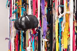 This is an image of a mixed media installation artwork made by John Outterbridge in 2012 titled: Rag Factory III.
