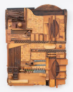 This is an image of a mixed media construction made by Noah Purifoy in 1988 titled: Wooden Tile.
