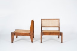 Image of Pierre Jeanneret, Pair of low chairs, c.1955-56 - front and side view