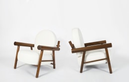 Attributed to Charlotte Perriand, pair of armchairs, diagonal and side views of both chairs