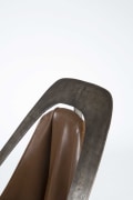 Alain Douillard's leather chair detailed view of metal frame and leather