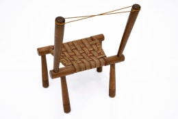 Gaston Castel's wooden chair back view