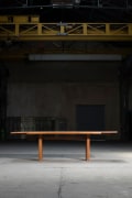 Pierre Chapo &quot;T14C&quot; dining table installation image in warehouse with &quot;D08&quot; extensions