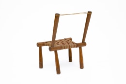 Gaston Castel's wooden chair back diagonal view