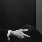 Hand grasping knee.