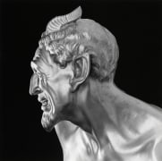 Statue in profile.