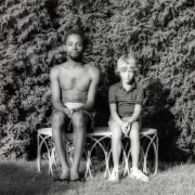 Jack Walls and a young boy sitting side by side.
