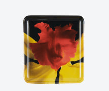 Square tray with a photograph of a red and yellow orchid against a black background.