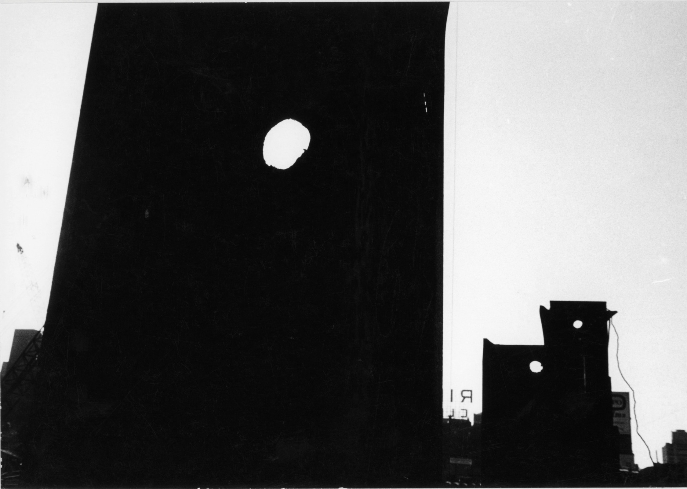 Louis Draper - Untitled (Dark silhouettes of buildings with three round holes, sign with "RI"), n.d | Art Basel 2020 | Bruce Silverstein Gallery