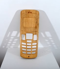 An old-school mobile cover, scaled up and hand carved out of wood.