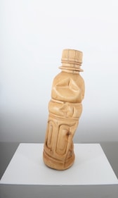 A water bottle, scaled up and hand carved out of wood.
