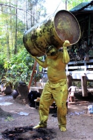 Bandu Manamperi Golden Barrel Man (Performance Still) 2013 C-print on archival paper 30 x 20 in.