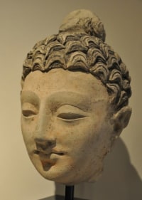 Head of Buddha 2 Ancient Region of Gandhara, Kushan Period 2nd/3rd Century Stucco with traces of pigment Height: 9.5 in.  NFS