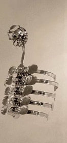 Adeela Suleman  Case 4, 2008, Steel drain covers, tongs, nuts and bolts, measuring and frying spoons, 34 x 14 x 11 in