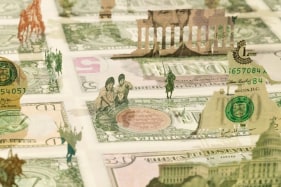 Abdullah M. I. Syed  Moneyscape VI: Playground of Alternative Economies (Detail)  2017  Hand-cut and assembled various uncirculated banknotes in custom light-box vitrine  22 x 22 x 10 in