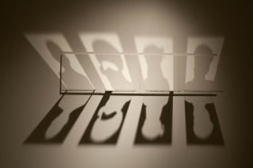 Amna Ilyas UNTITLED 5 (The Passport) 2009 Glass, silver, wood 12 x 48 x 10 in.