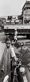 Raghu Rai TRAFFIC CONSTABLE AND HOURSE BAGGHIE, KOLKATA 2004 Digital scan of photographic negative on archival paper 54 x 20 in.