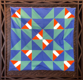 Christopher Joshua Benton  Our Target is Zero Accident  Fabric swatches from shuttered upholstery business, wood  39.37h x 39.37w in