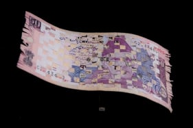 Abdullah M. I. Syed Weaving Myth II (Flying Rug Series) Hand-cut and weaved 50 Indian Rupee and 50 Pakistani Rupee with custom Perspex vitrine 6 x 10 in. 2013