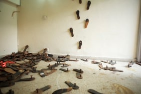 G. R. Iranna PADUKA INSTALLATION 2013 Wooden Paduka sandals and police light Dimension variable