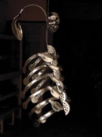 Adeela Suleman, Case 1, 2008, Steel drain covers, tongs, nuts and bolts, measuring and frying spoons, 34 x 14 x 11 in