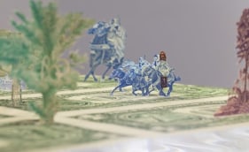 Abdullah M. I. Syed  Moneyscape VI: Playground of Alternative Economies (Detail)  2017  Hand-cut and assembled various uncirculated banknotes in custom light-box vitrine  22 x 22 x 10 in