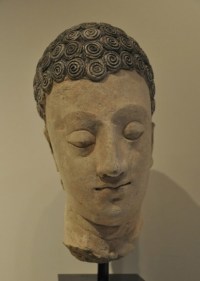 Head of Buddha 1 Ancient Region of Gandhara, Kushan Period 2nd/3rd Century Stucco with traces of pigment Height: 10 in.  NFS