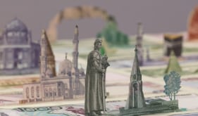 Abdullah M. I. Syed  Moneyscape V: Temenos (Detail)  2017  Hand-cut and assembled various uncirculated banknotes in custom light-box vitrine  22 x 22 x 10 in