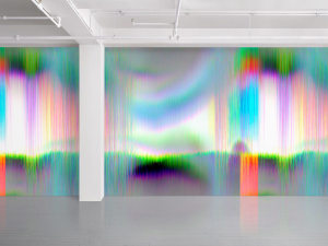 An installation image of James Hoff's "Skywiper 122," a vinyl wallpaper made up of bright green, orange, purple, blue striations and glitches