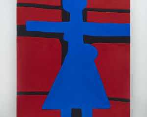 A photograph of a predominantly red surface with a blue figure shape in the center, arms outstretched, with a triangular bottom section. There are black lines that define a cross behind the figure.