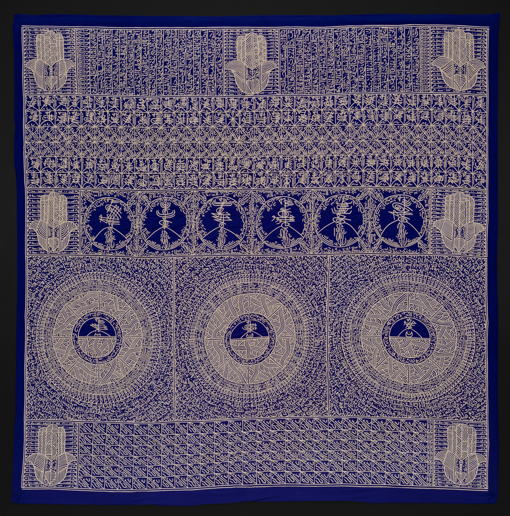 Applique with indigo background and gold intricate graphics