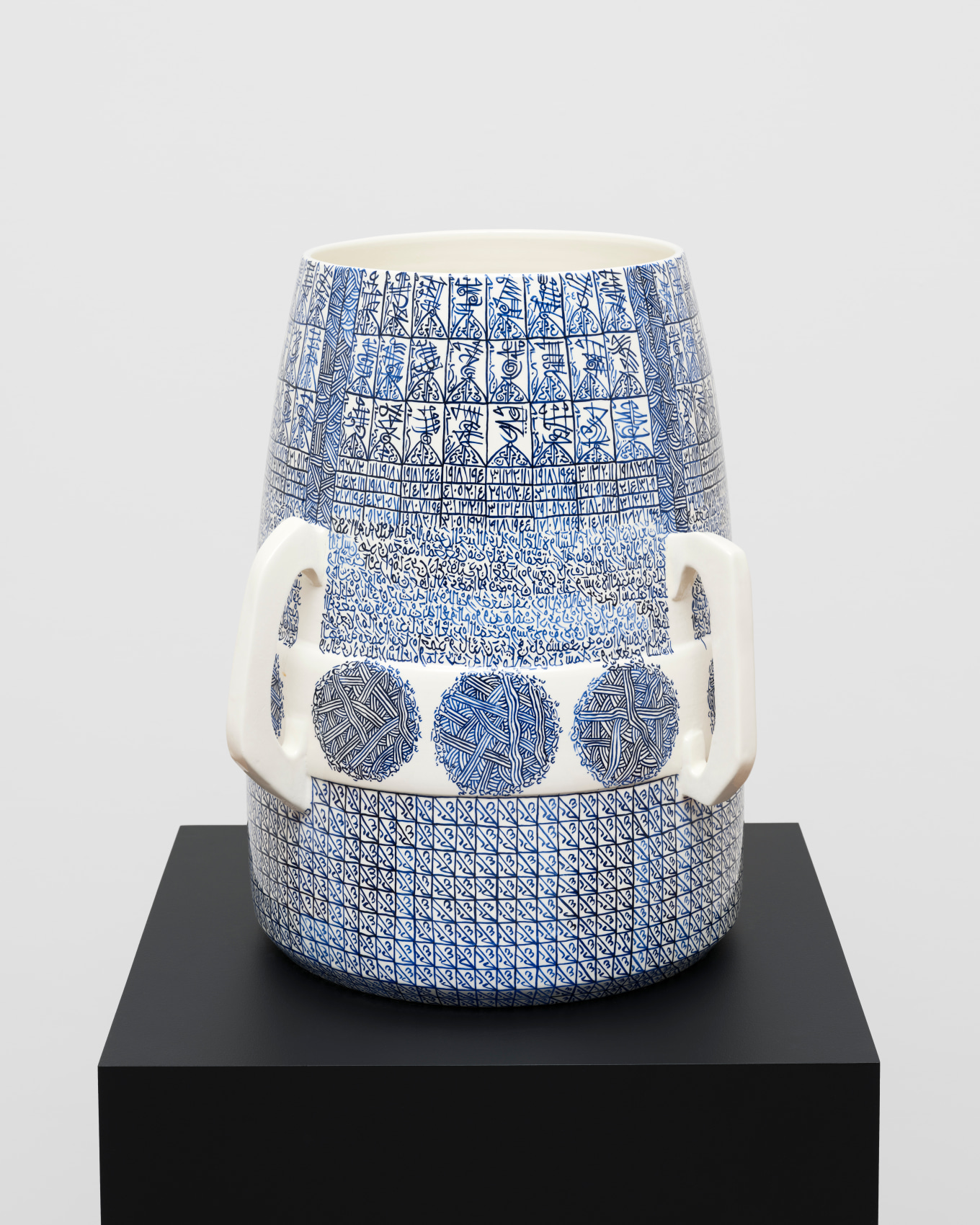 White ceramic with blue graphic patterns