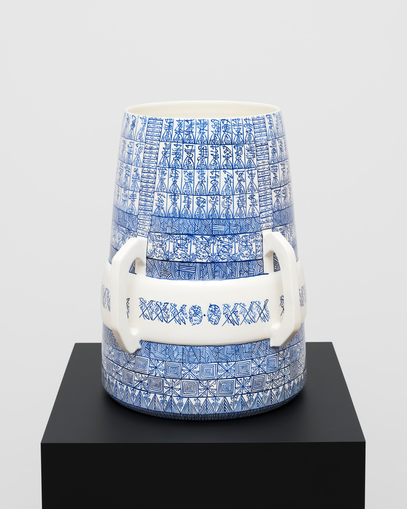 White ceramic with blue graphic patterns