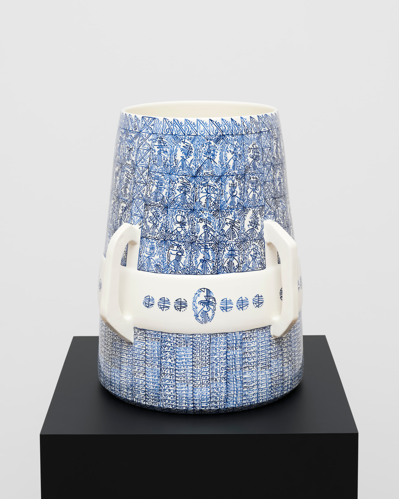 White ceramic with blue graphic patterns