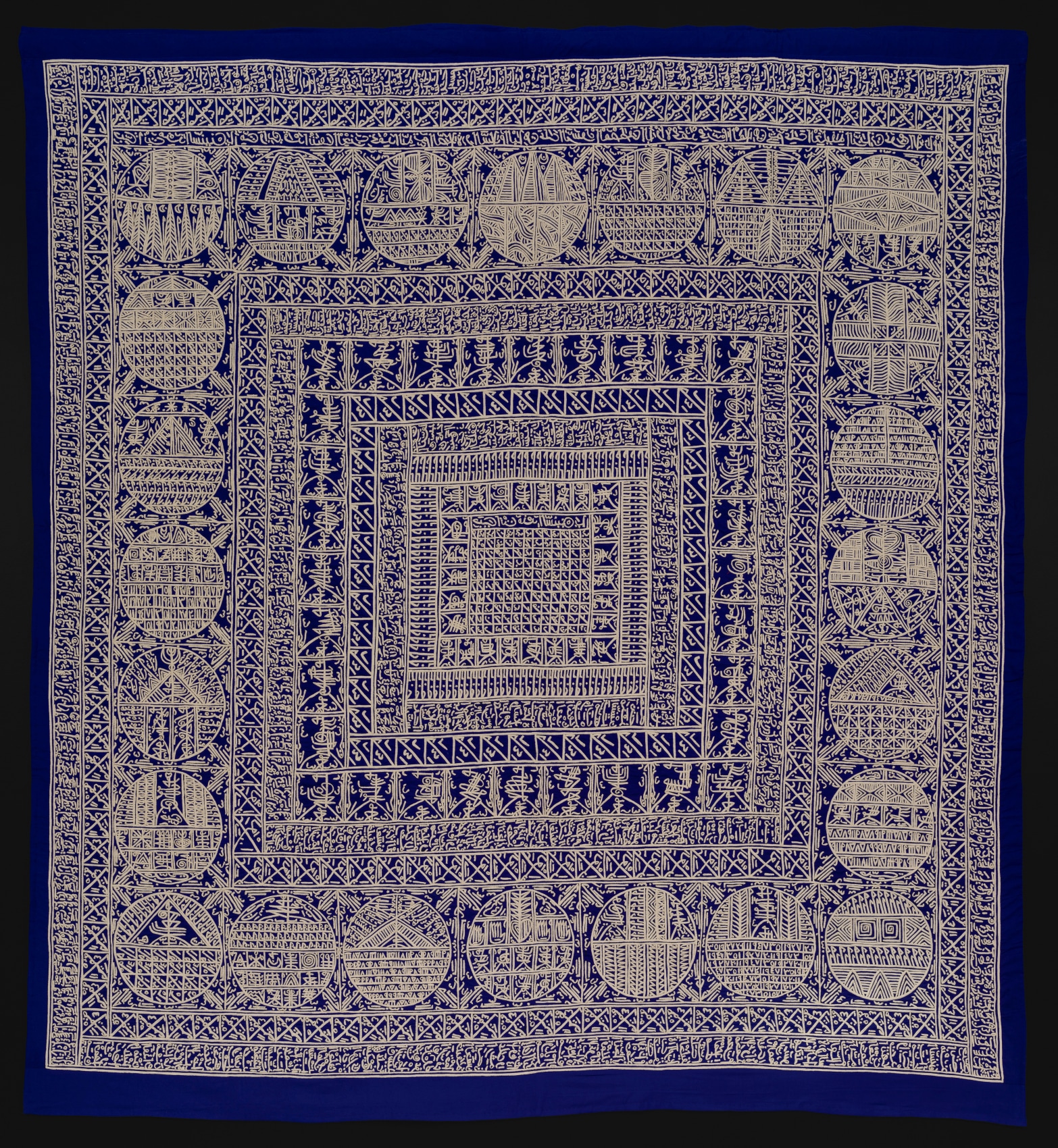 Applique with indigo background and gold intricate graphics