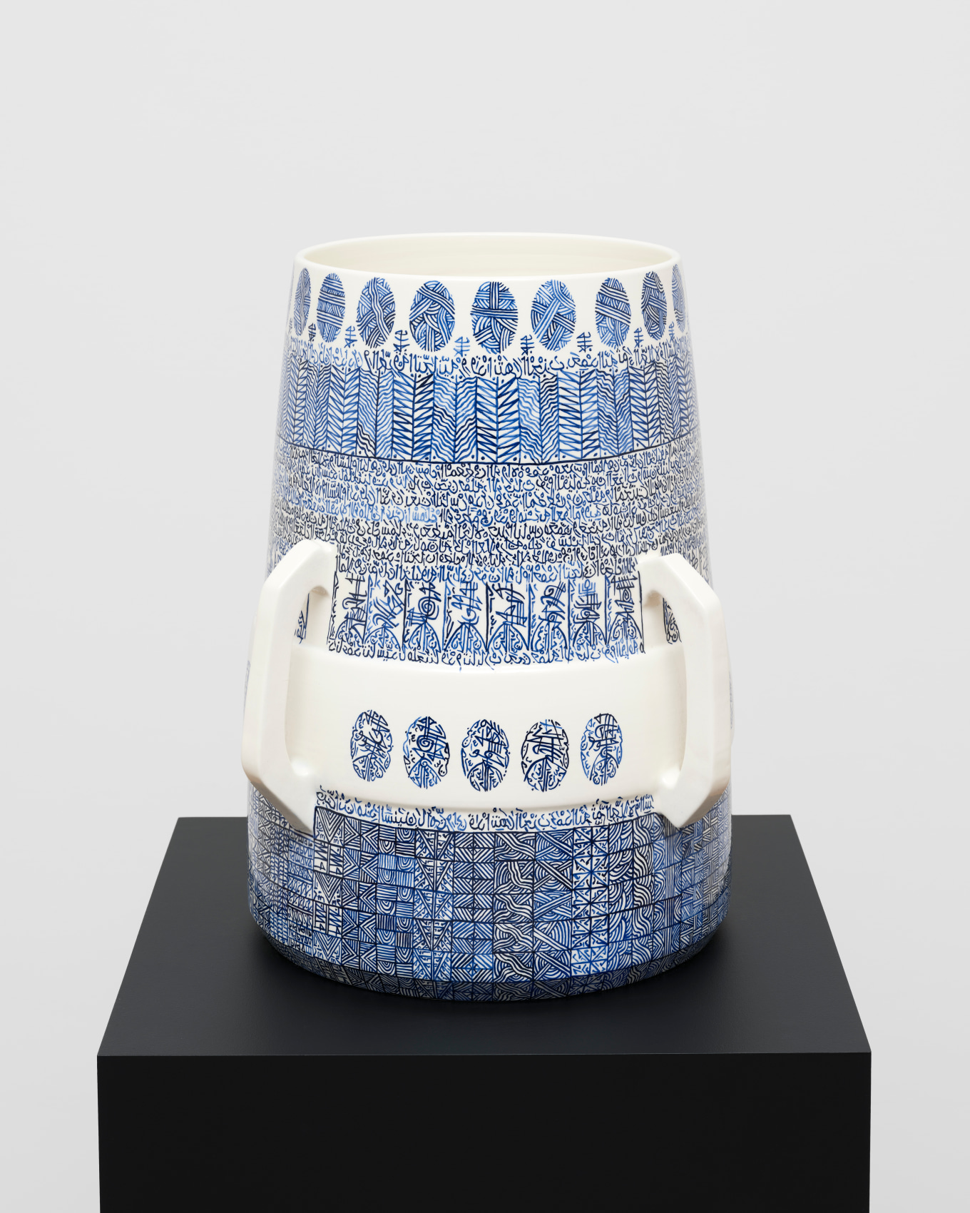 White ceramic with blue graphic patterns