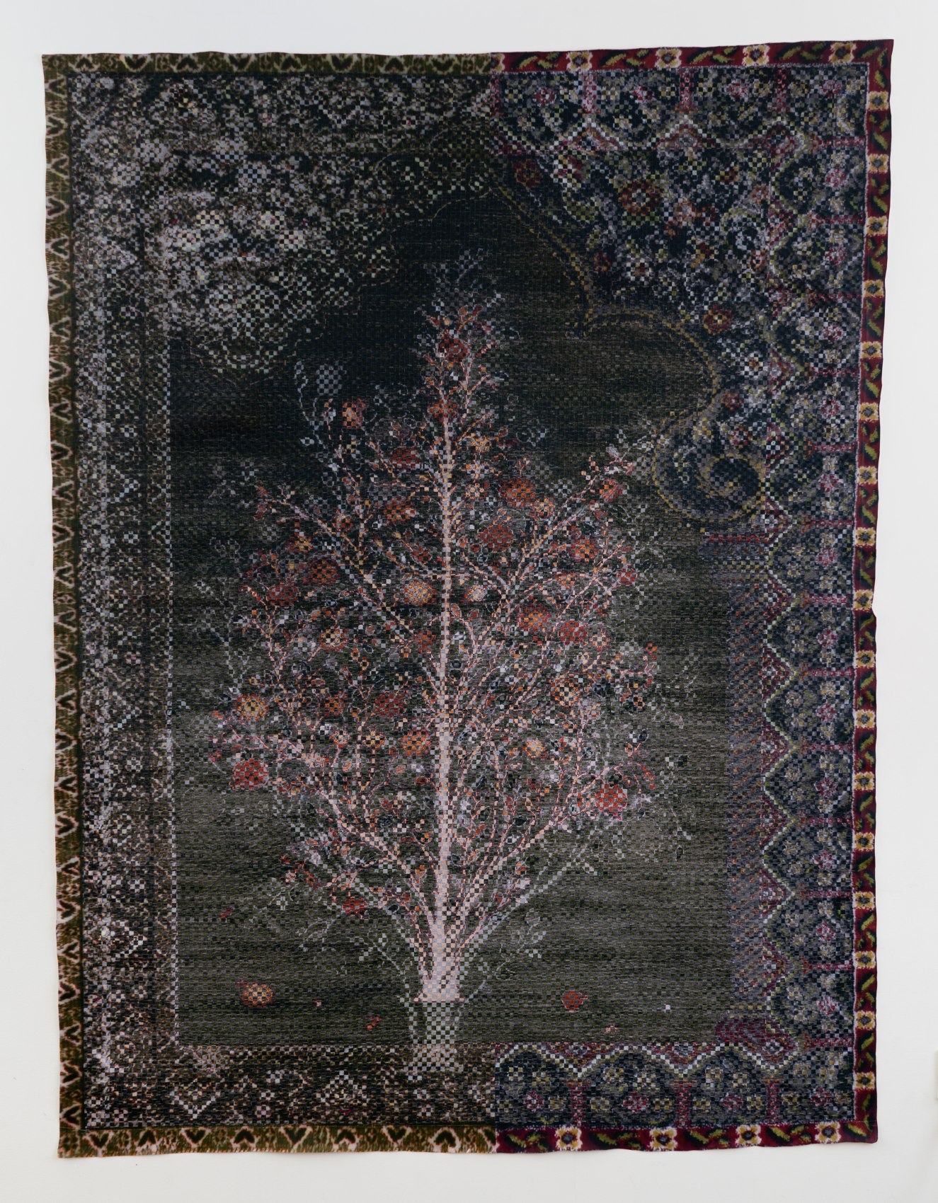 Woven paper artwork reminiscent of an oriental rug - center is a large tree