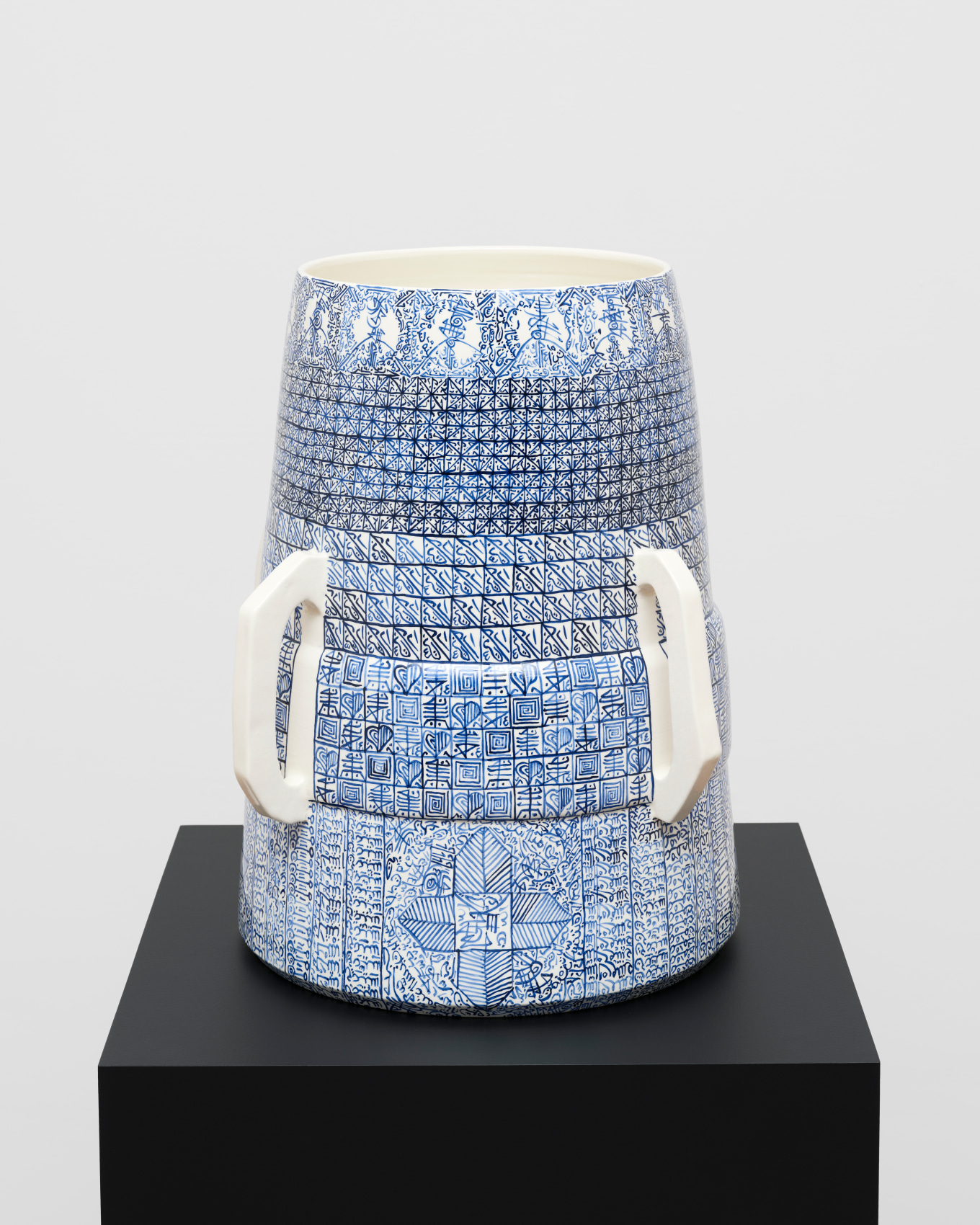 White ceramic with blue graphic patterns