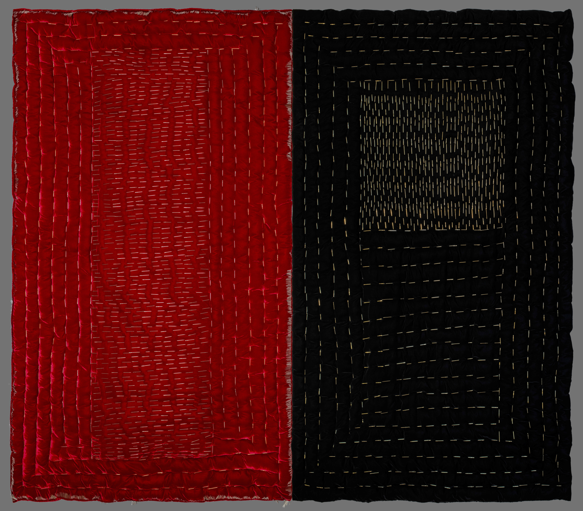 Comforters embroidered with pins that lay on a floating platform just off of the ground