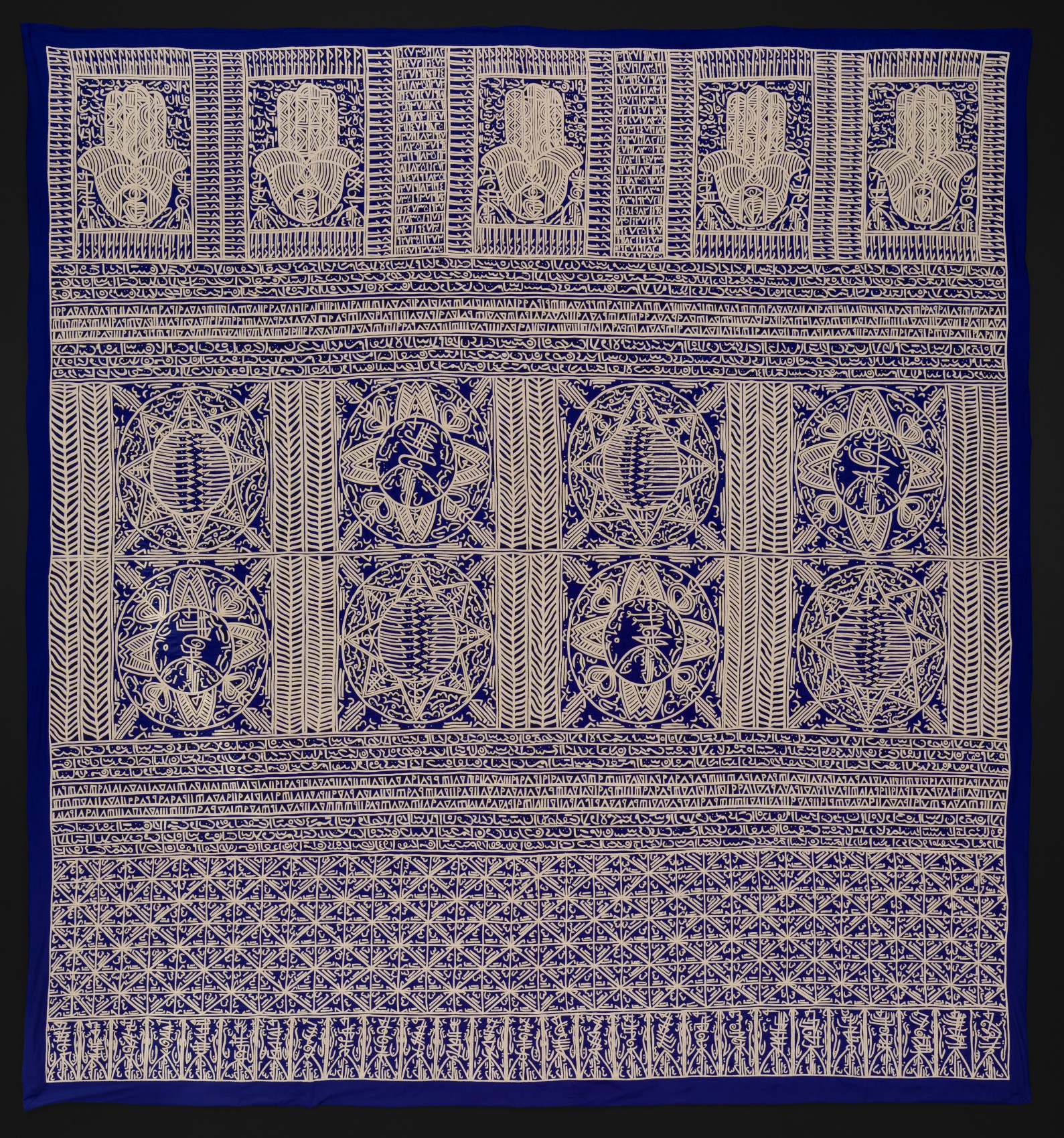 Applique with indigo background and gold intricate graphics