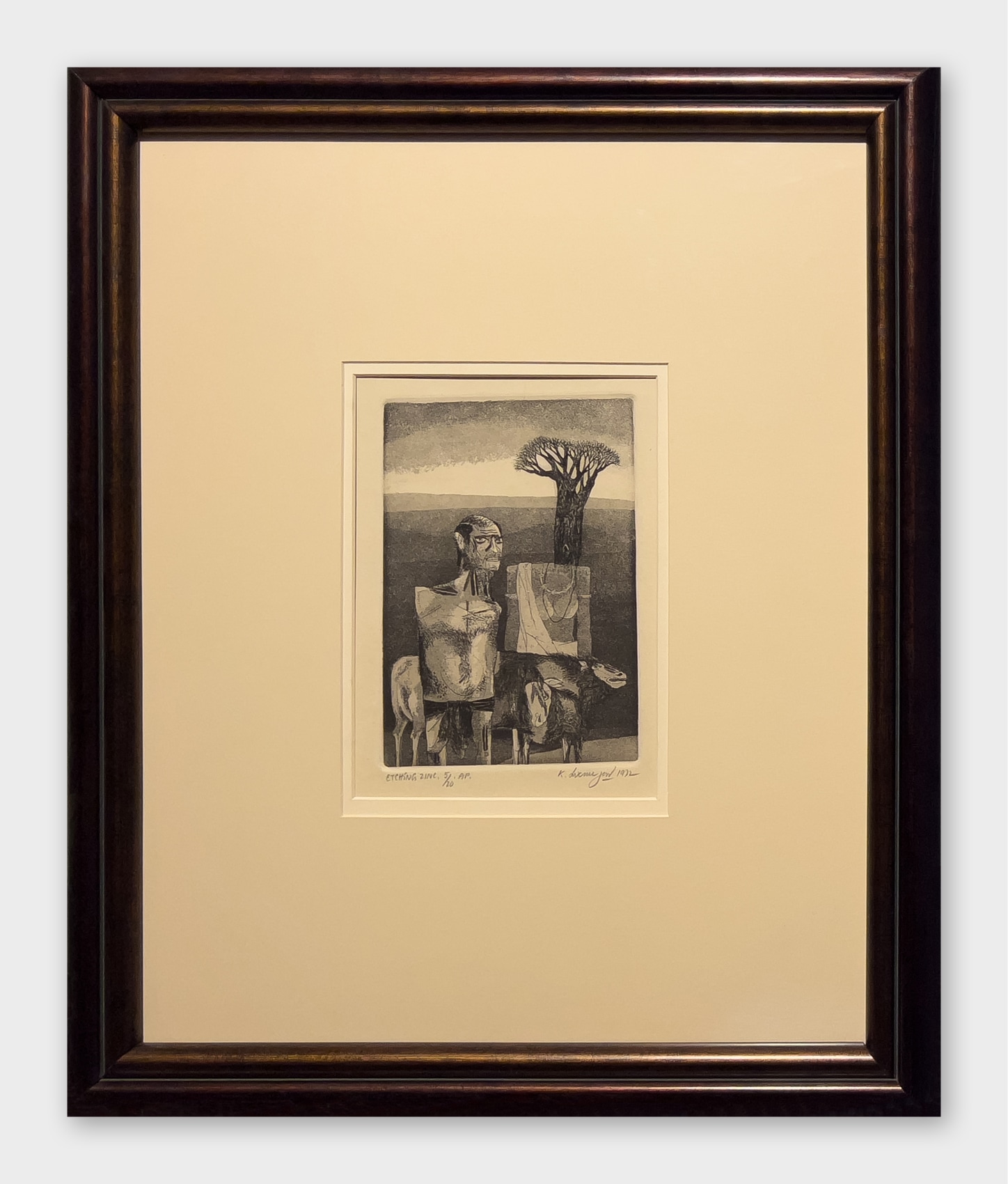 man with goats near a tree