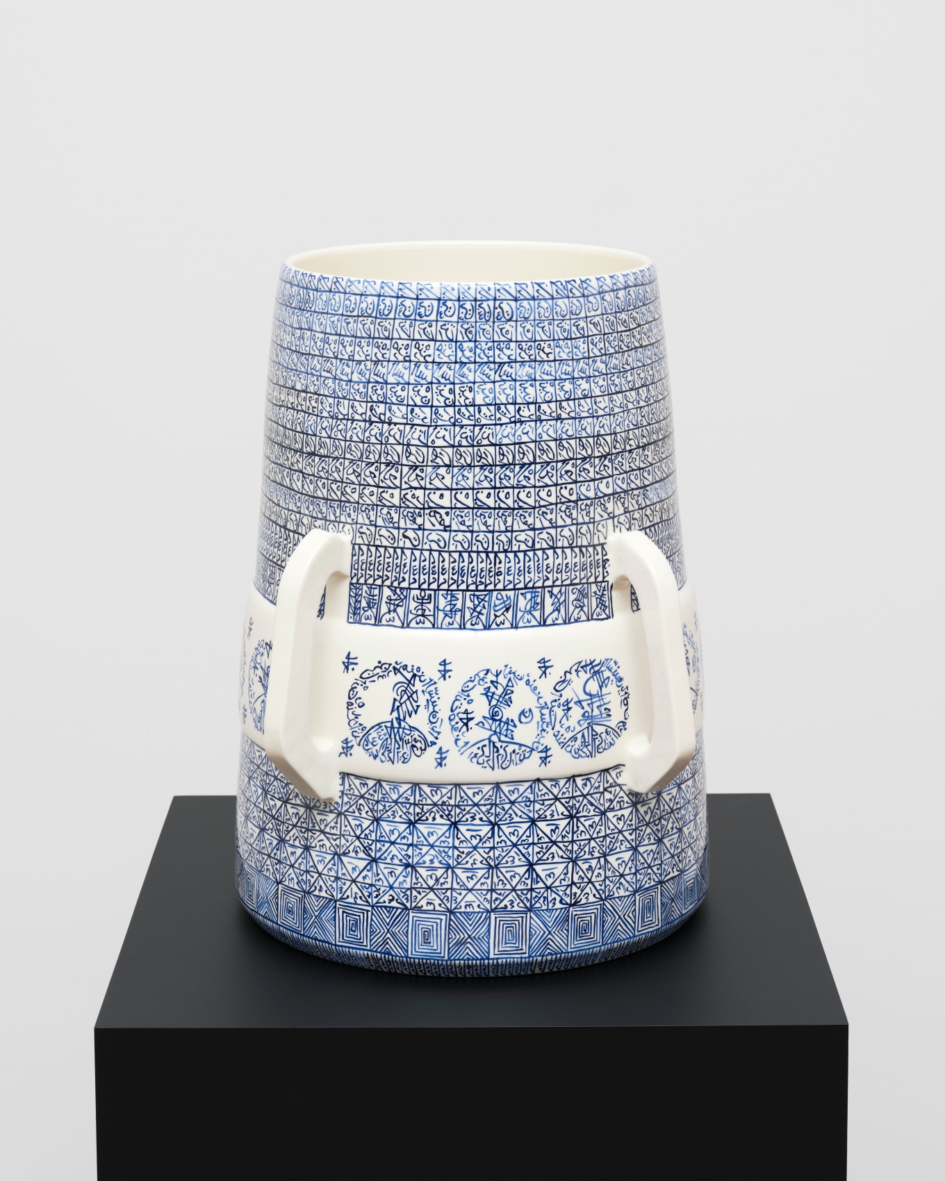 White ceramic with blue graphic patterns
