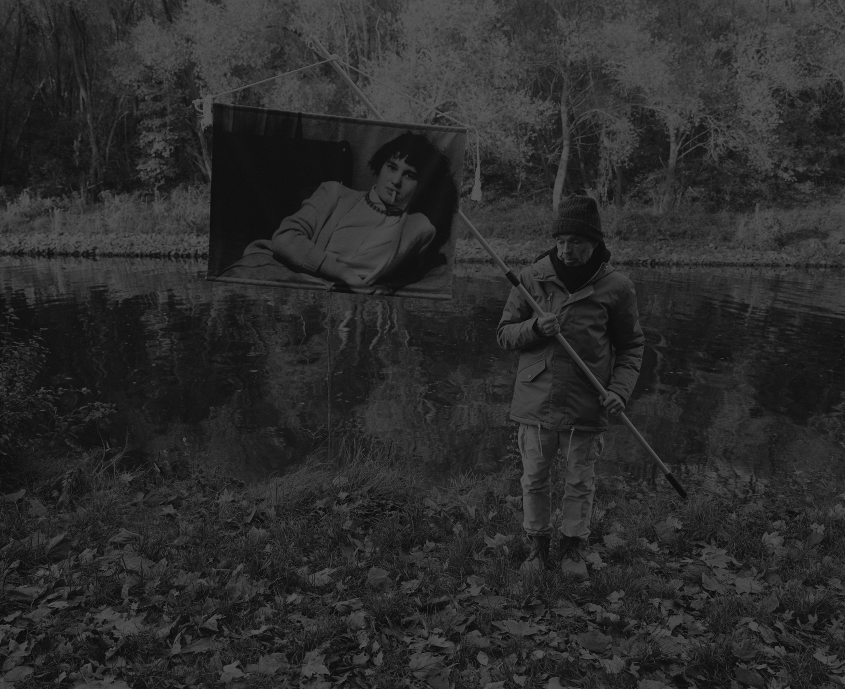 Daniel Joseph Martinez Teltow Channel close to the Dreilinden roadhouse. The Teltow Channel, (German: Teltowkanal) is a canal that lies in both the states of Berlin (south) and Brandenburg, and at points forms the boundary between the two. Hidden away near the Teltowkanal is the old border control point and roadhouse Dreilinden. The area is part of a nature reserve. Nearby is a bridge across the canal which was divided by a piece of wall during the GDR period, making it impassable., 2017 Medium format black & white film printed digitally on Hahnemule Fine Art Baryta, Gloss 315gsm 60 x 72 in (152.4 x 182.88 cm)