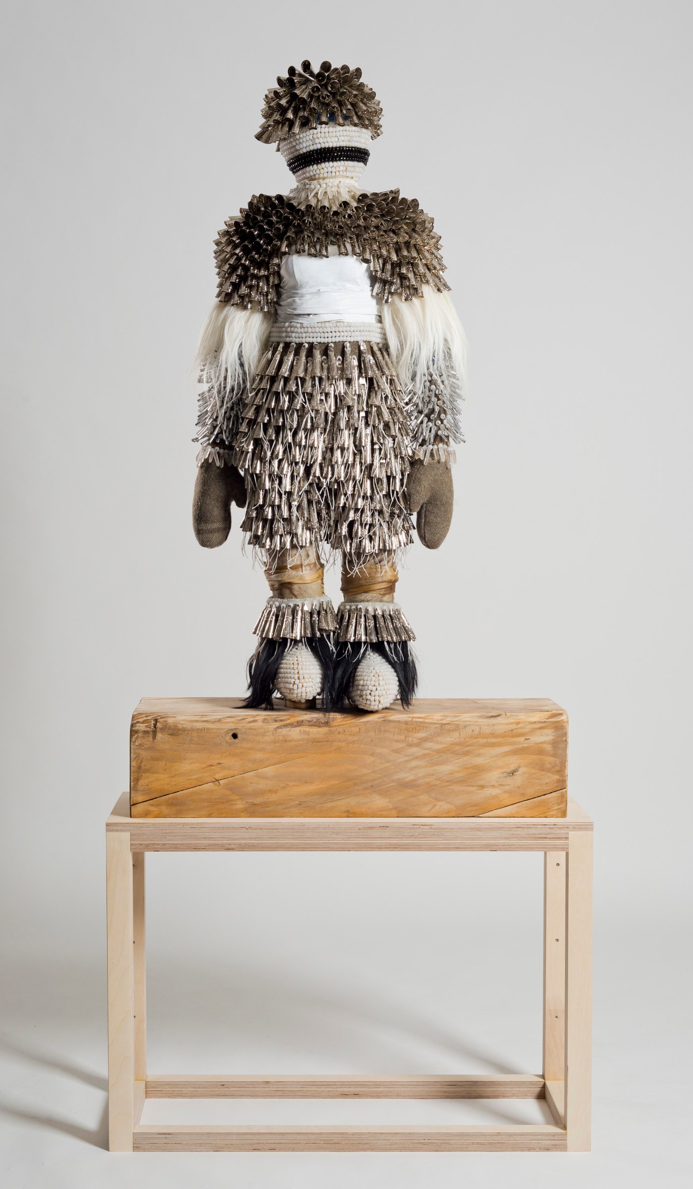 Jeffrey Gibson Eternal Return,&nbsp;2014 Wool, glass and plastic beads, acrylic yarn, deer rawhide, angora goat fur, quartz crystals, tin and copper jingles, steel and brass studs, artificial sinew, nylon thread, metal wire, steel rods, found railroad tie 86 x 27 x 14 in including wood block (218.44 x 68.58 x 35.56 cm) Collection of The Philbrook Museum, Tulsa, Oklahoma