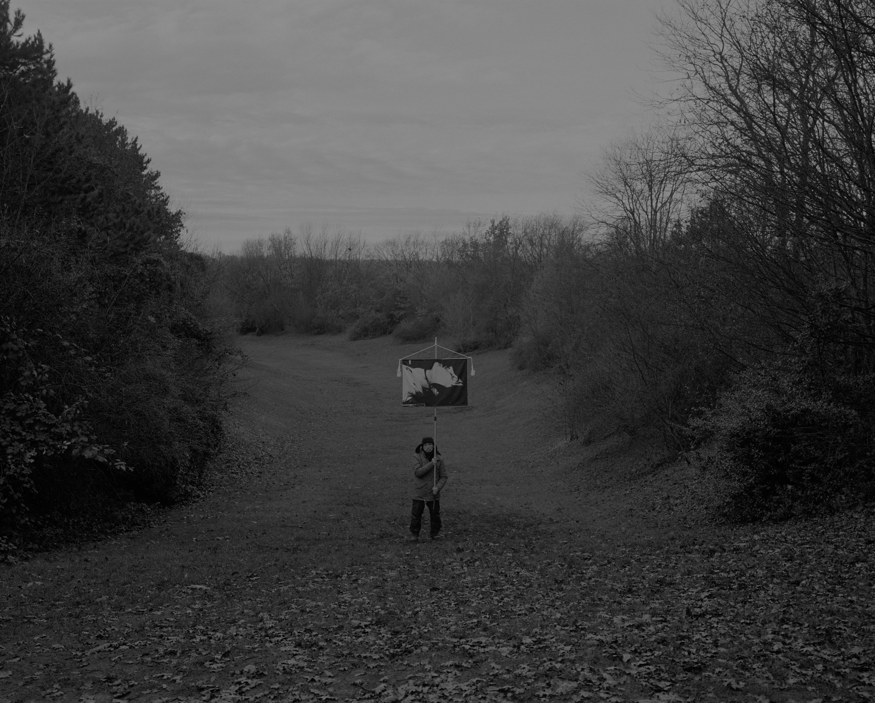 Daniel Joseph Martinez This was a tiny valley floor at the "Rudower Höhe". The park is located in the districts of Rudow and Alt-Glienicke. The Rudower Höhe was created from a 70-meter-high mountain of rubble in the 1950s. Further east, the Wall ran before the turnaround. Approximately 400 meters of the Eall can still be seen in the original. Since 2001, these remains have been declared a Historic Monument., 2017 Medium format black & white film printed digitally on Hahnemule Fine Art Baryta, Gloss 315gsm 60 x 72 in (152.4 x 182.88 cm)