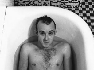 Keith Haring in bathtub by Don Herron
