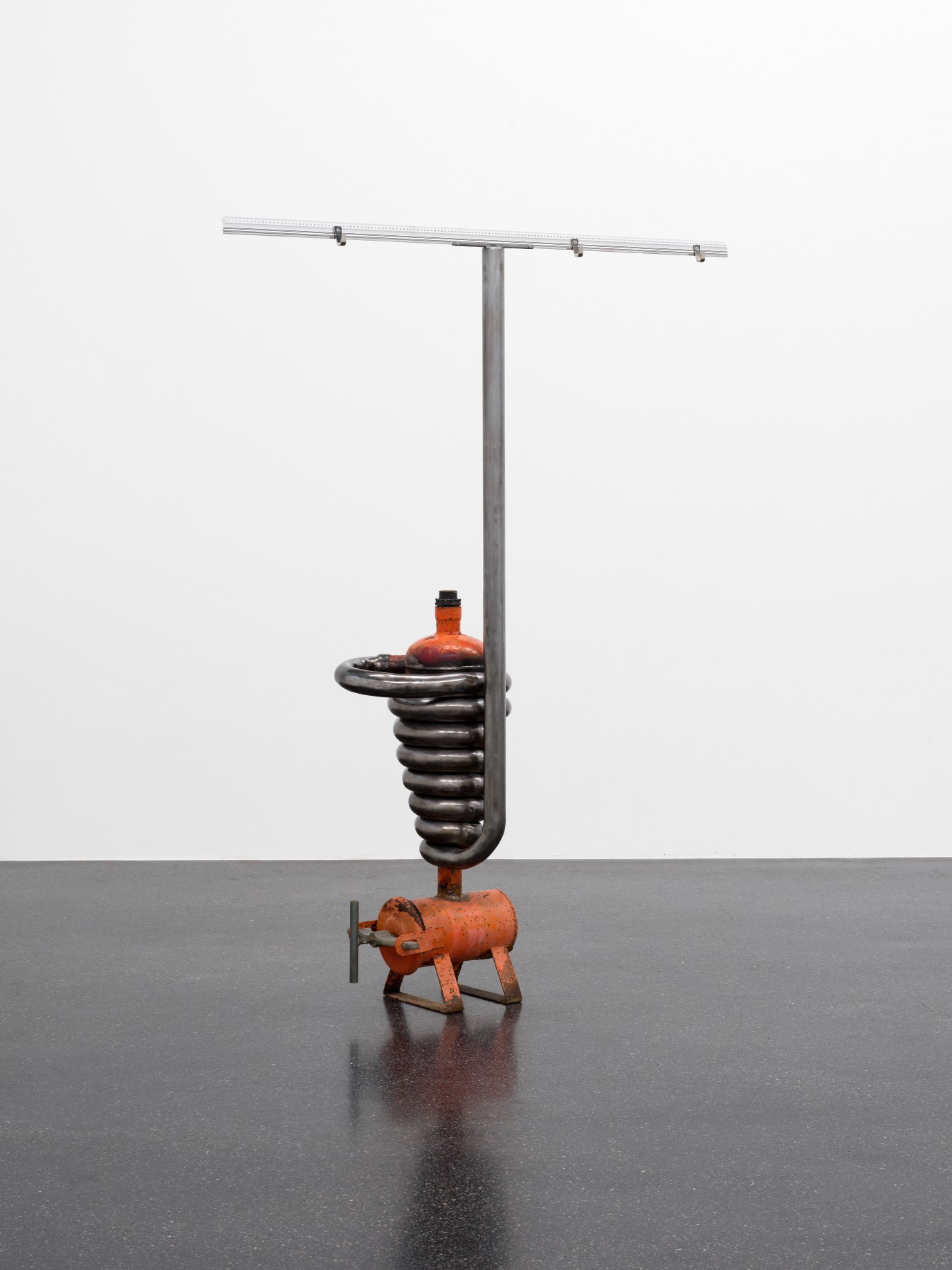 Dozie Kanu, Hang something metric, 2022, Found water pump component, steel, coat hanging clips, 150 cm measuring stick, 250 x 150 x 40 cm. Courtesy the artist and Galerie Francesca Pia