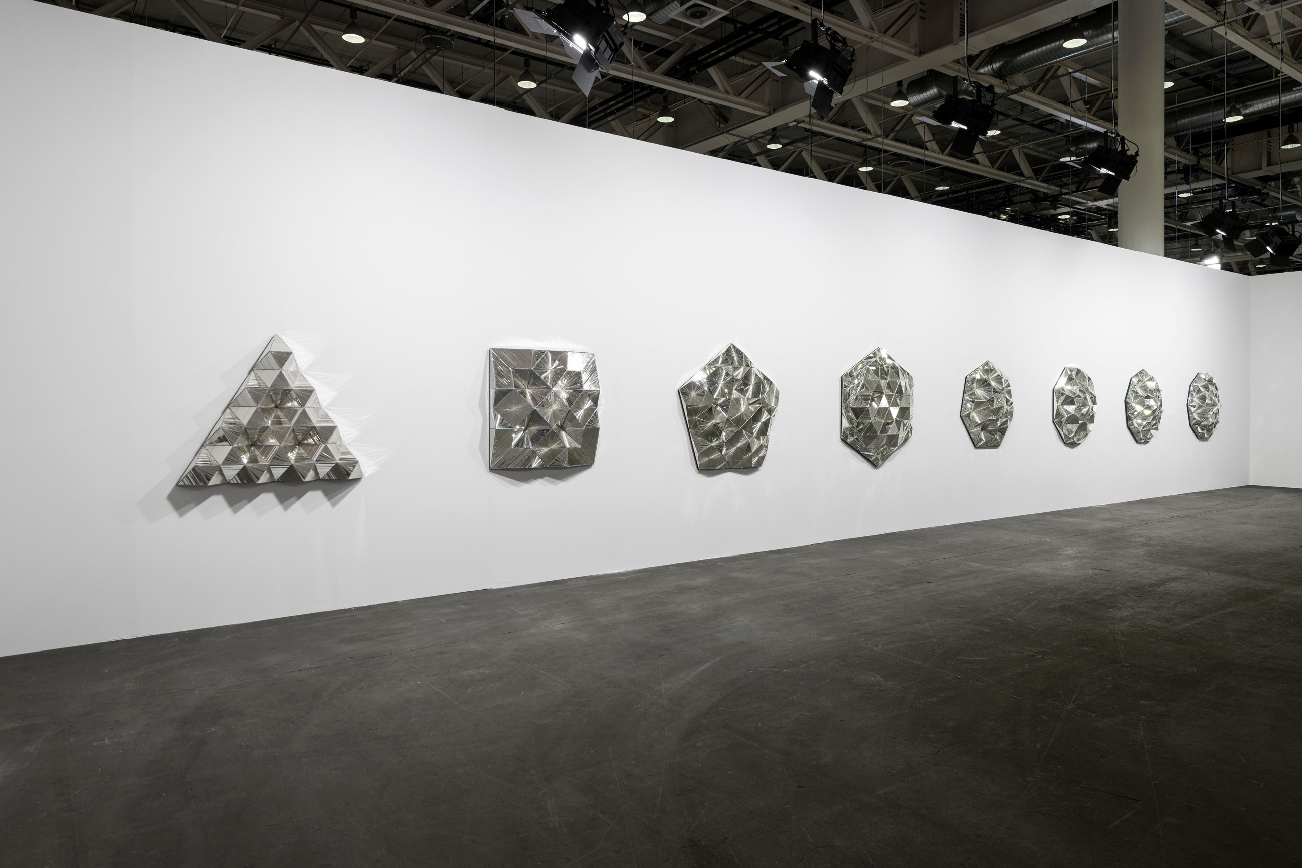 Installation view, Monir Shahroudy Farmanfarmaian,&nbsp;Third Family, 2011,&nbsp;Series of 8 sculptures,&nbsp;Reverse painted glass, mirrored glass, and plaster,&nbsp;Dimensions variable, Art Basel Unlimited, Switzerland