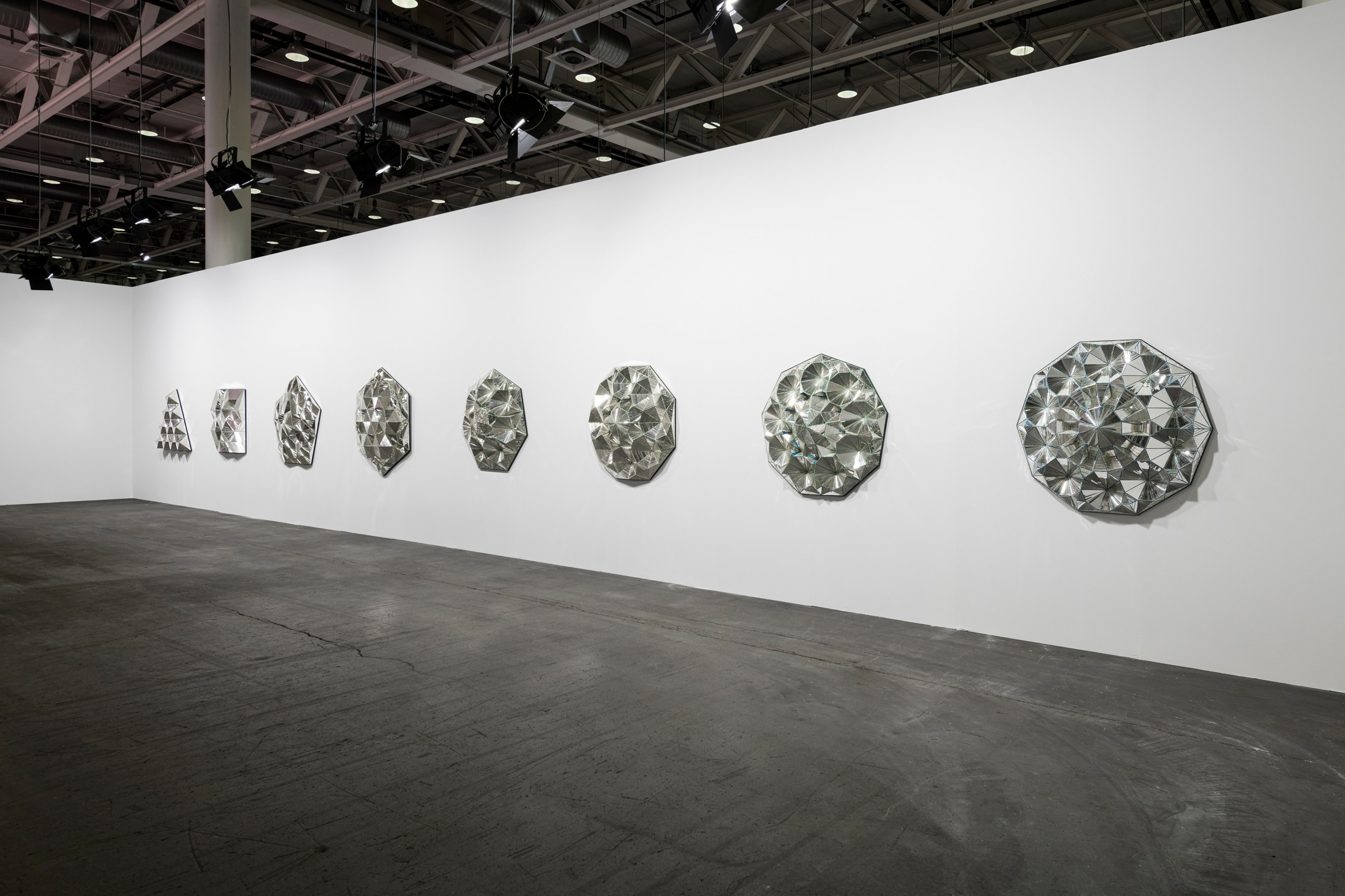 Installation view, Monir Shahroudy Farmanfarmaian,&nbsp;Third Family, 2011,&nbsp;Series of 8 sculptures,&nbsp;Reverse painted glass, mirrored glass, and plaster,&nbsp;Dimensions variable, Art Basel Unlimited, Switzerland