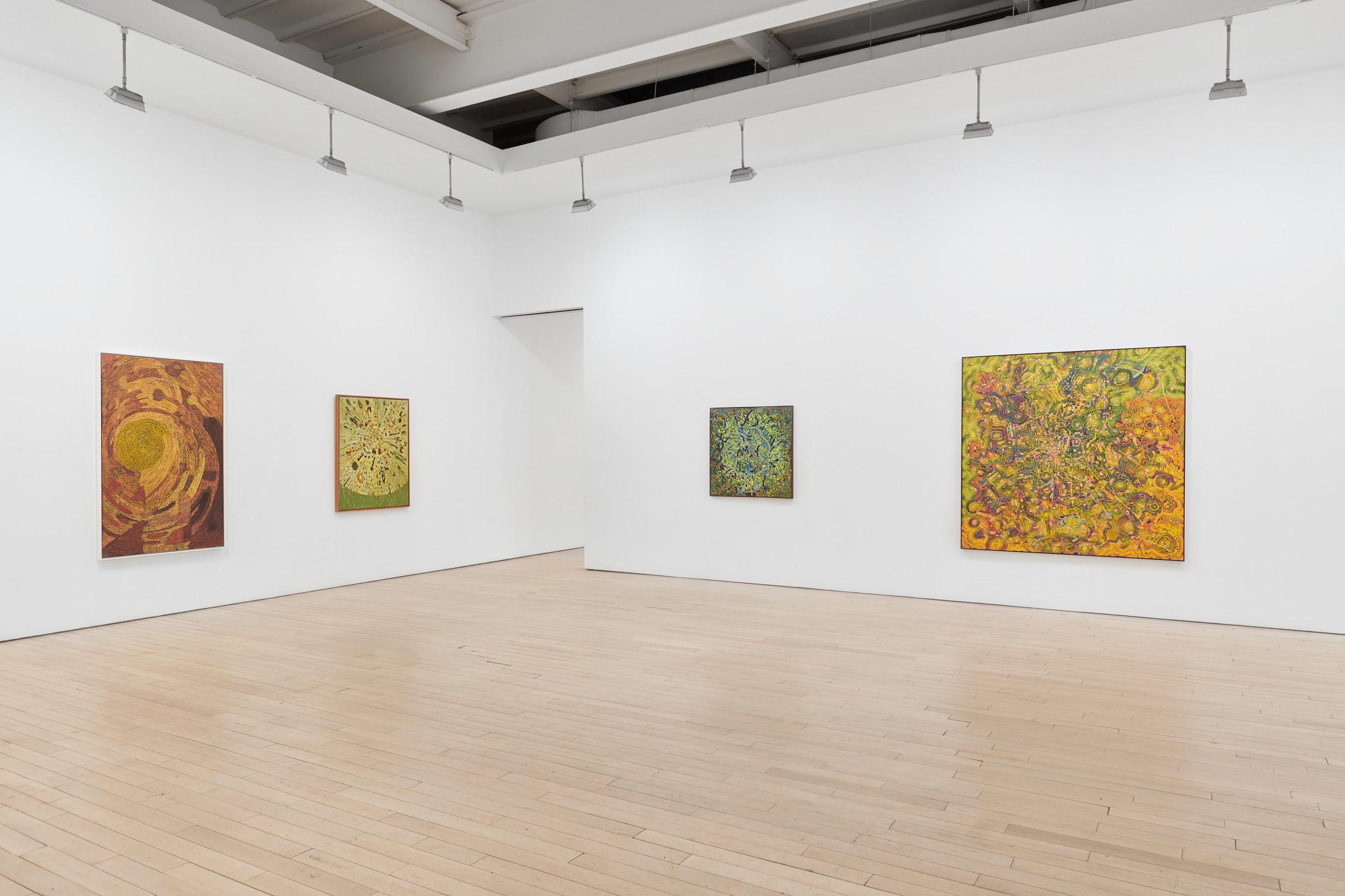 Installation view of four artworks
